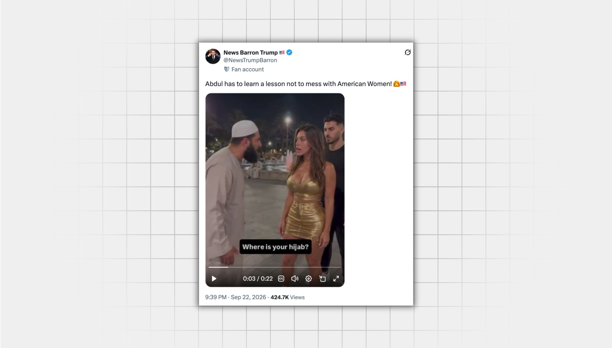 There is a screenshot of an X post that has manipulated media from a user with the username “@NewsTrumpBarron” that reads: Abdul has to learn a lesson not to mess with American Women!” with an emoji of a blonde woman and an American flag emoji. There is an image from the video in the post, which is an AI-generated video of a muslim man in a gray thobe wearing a kufi telling a white woman in a gold crop top and gold skirt that she needs to wear a hijab. They yell at each other, and she ends up kicking him in the groin, and he falls over. There is also a man in a black short-sleeve shirt behind the woman.